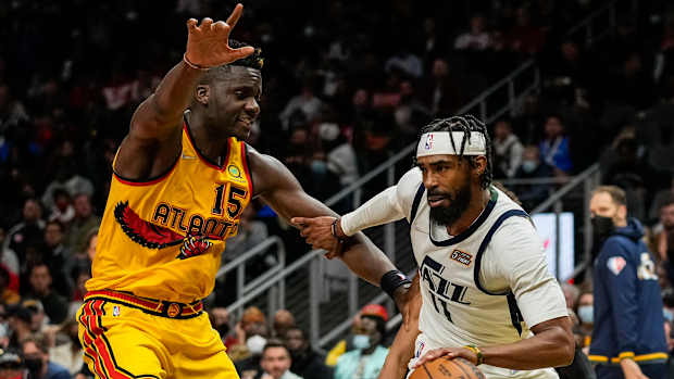 Hawks center Clint Capela defends Jazz guard Mike Conley.